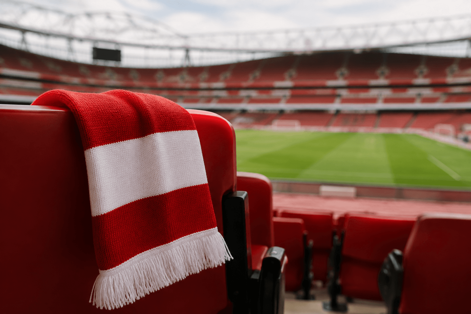 Red-and-white supporters’ scarf in a football stadium